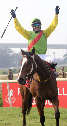 Jockey Vivek exults after winning the Indian Oaks on Psychic Star at Mumbai on Sunday. Photo credit Amit Gupta